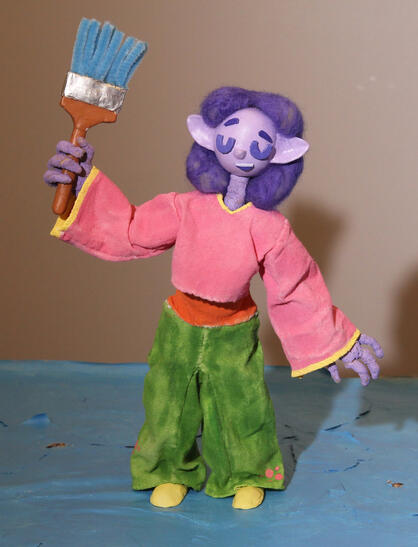 Alien holding paint brush